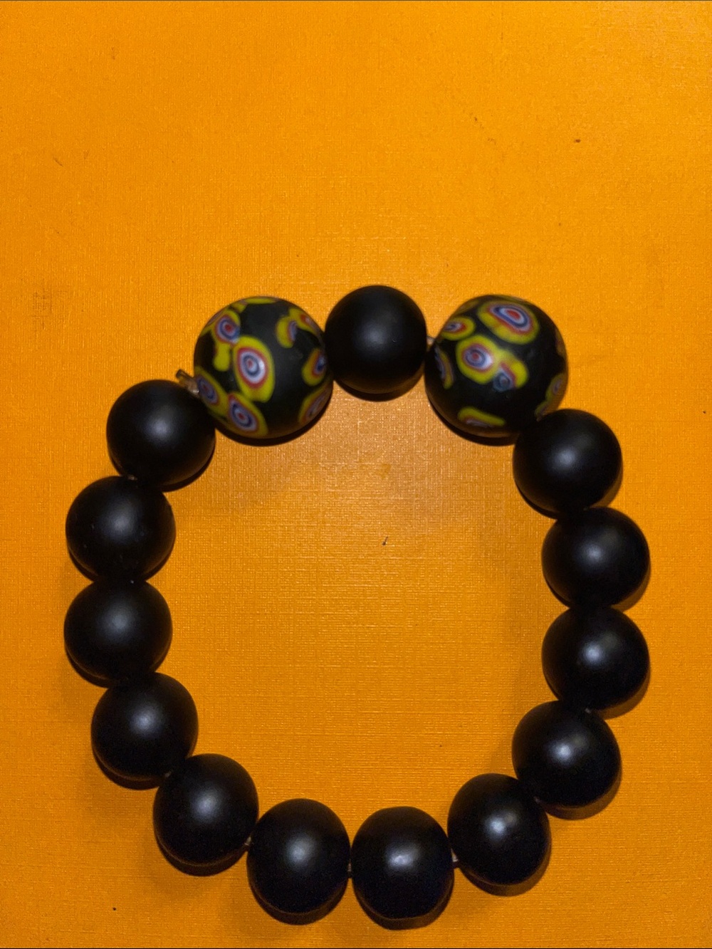 Black Beaded Stretch Bracelet with Yellow Pattern Accent Beads